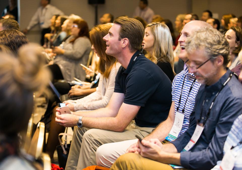People reacting to a presentation at the ESTO conference.