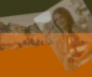 Display ad with Free to Roam headline, a warm picture of Mount Rushmore at sunrise and a young female tourist smiling in a scenic location holding a 35mm camera.